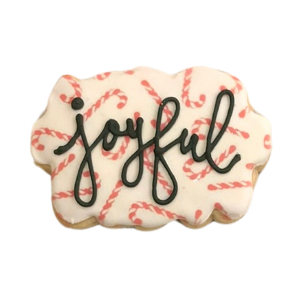 Holiday Greetings cookie with candy cane pattern and joyful text