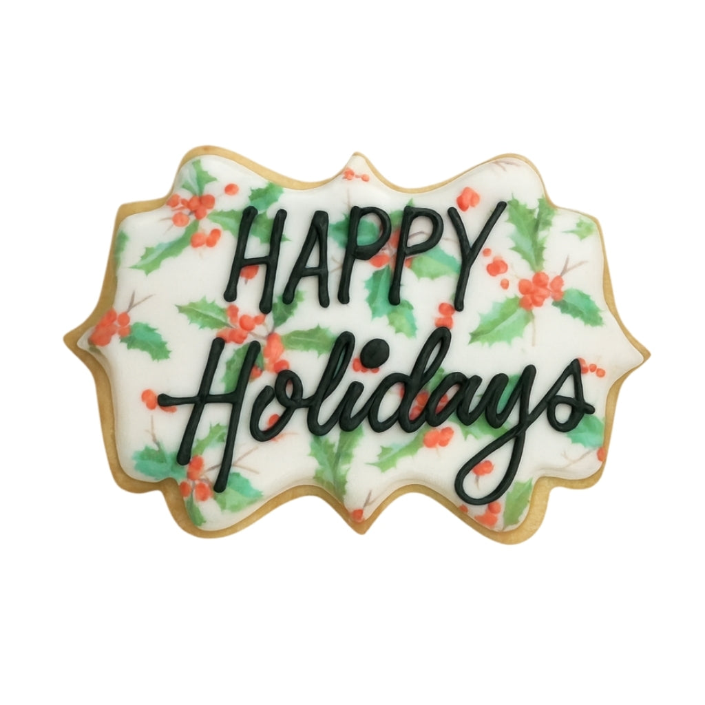 Holiday Greetings cookie with holly and berry icing design.