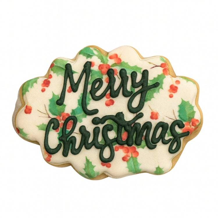 Holiday Greetings cookie with holly and Merry Christmas text.