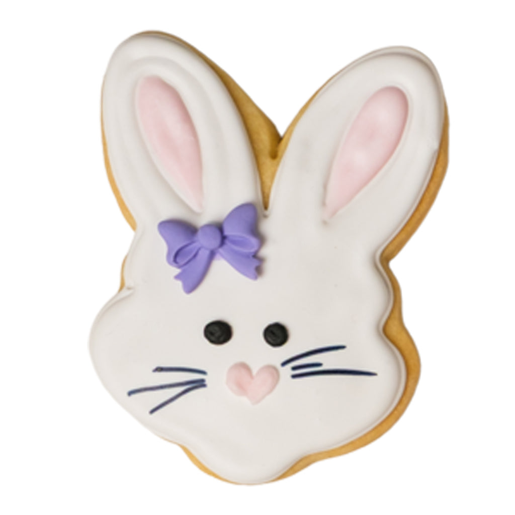 Easter butter cookie shaped like a bunny with a purple bow.