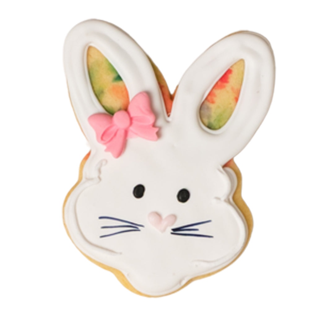 Easter butter cookie shaped like a white bunny with a pink bow.