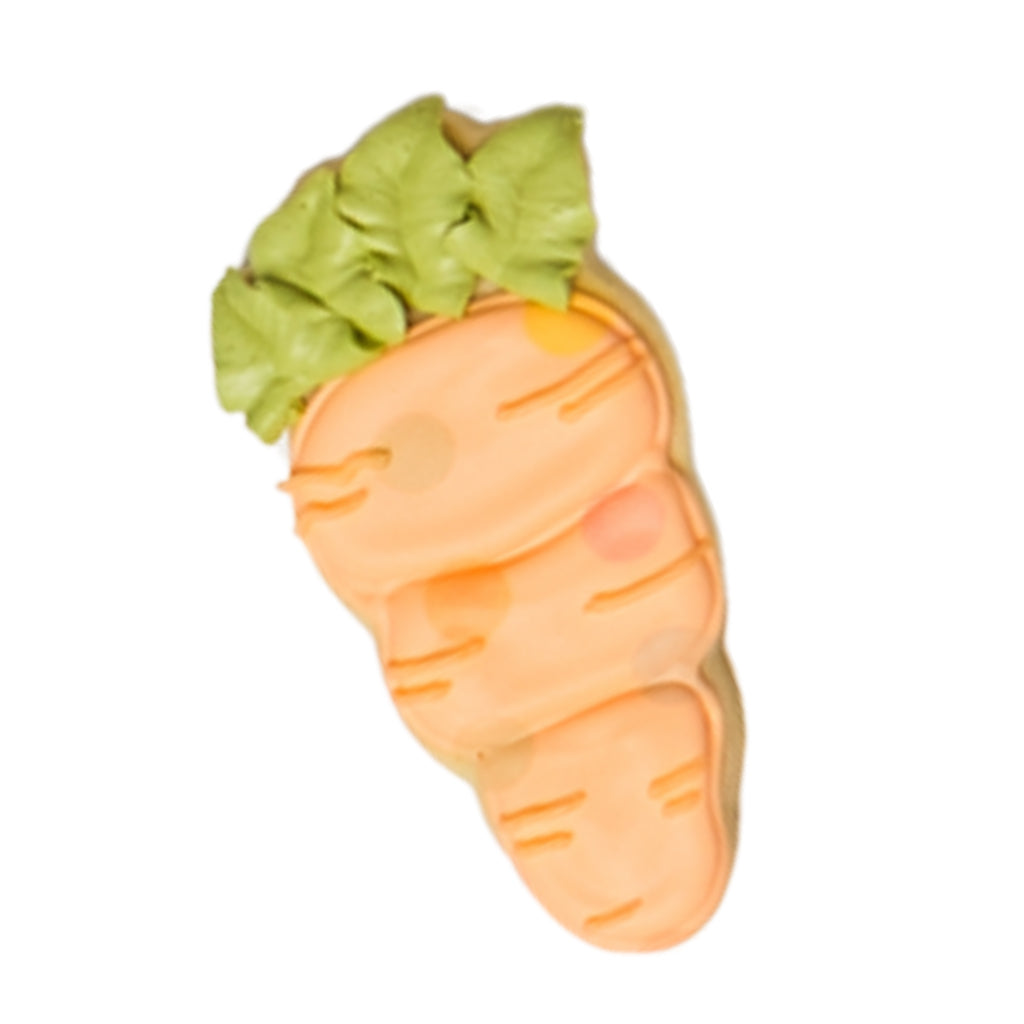 Easter butter cookie shaped like a carrot with green frosting.