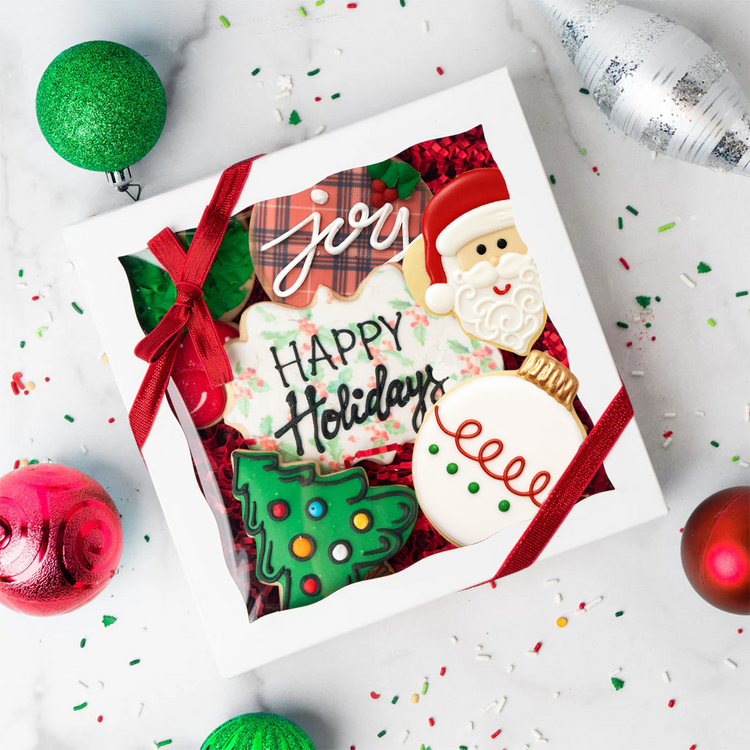 Gift box of Christmas butter cookies with festive icing.