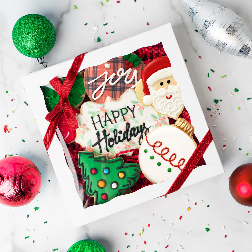 Gift box of Christmas butter cookies with festive icing.