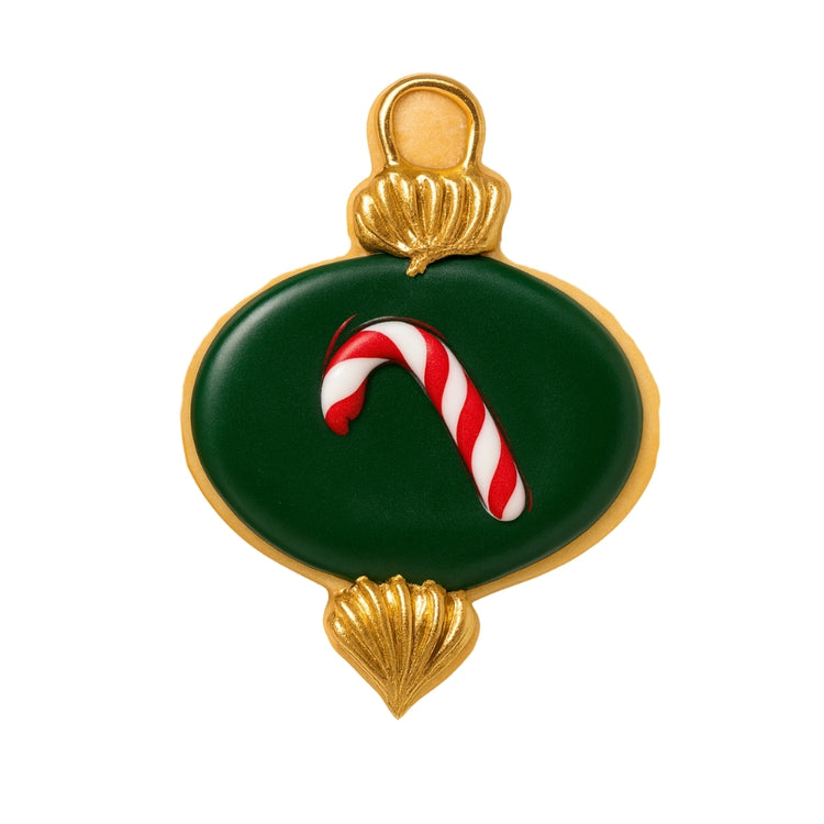 Ornament cookie with green icing and a candy cane design.