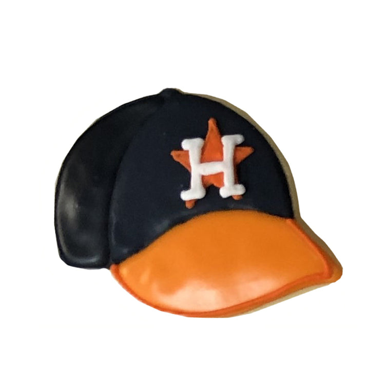 Astros cookie shaped like a navy and orange baseball cap