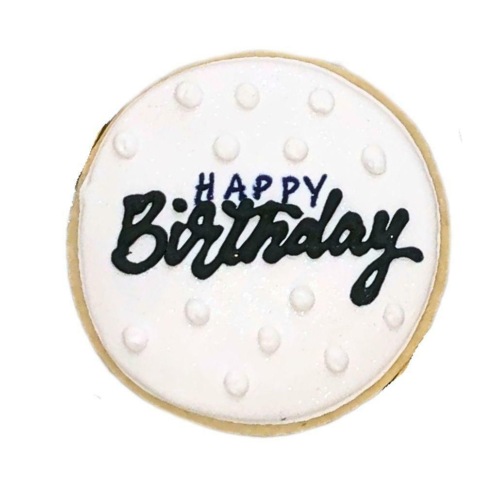 Golf cookie with white icing and black Happy Birthday text.