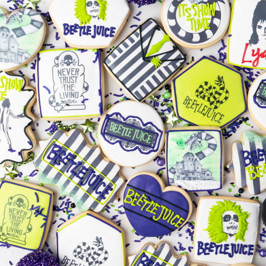 Assorted Beetlejuice butter cookies with themed icing designs.