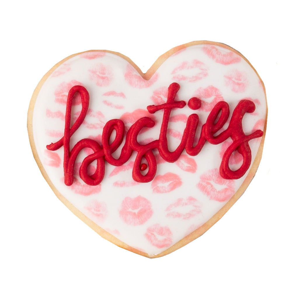 Heart-shaped Valentine butter cookie with red besties text.