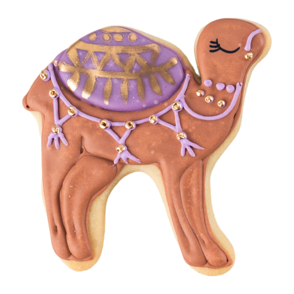 Camel-shaped Ramadan butter cookie with purple and gold icing.