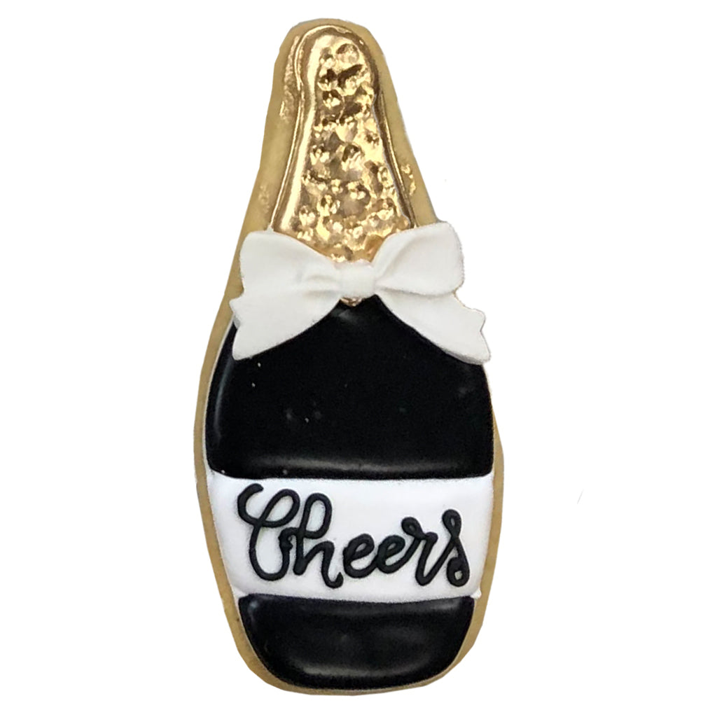 Champagne bottle cookie decorated with a white bow and Cheers.