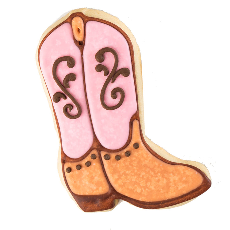 Cowboy Couture cookie shaped like a pink and tan western boot.