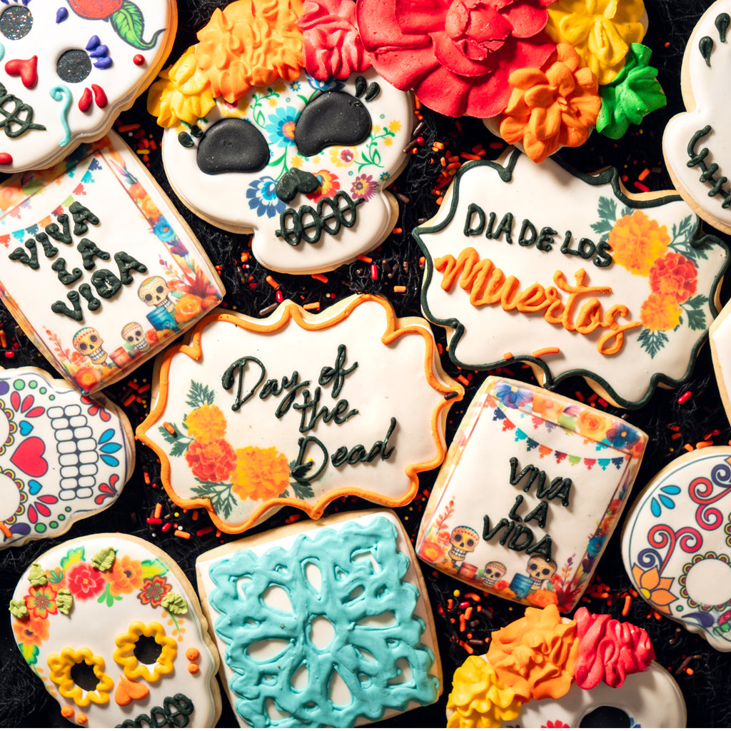 Assorted Day of the Dead cookies with colorful sugar skull icing.