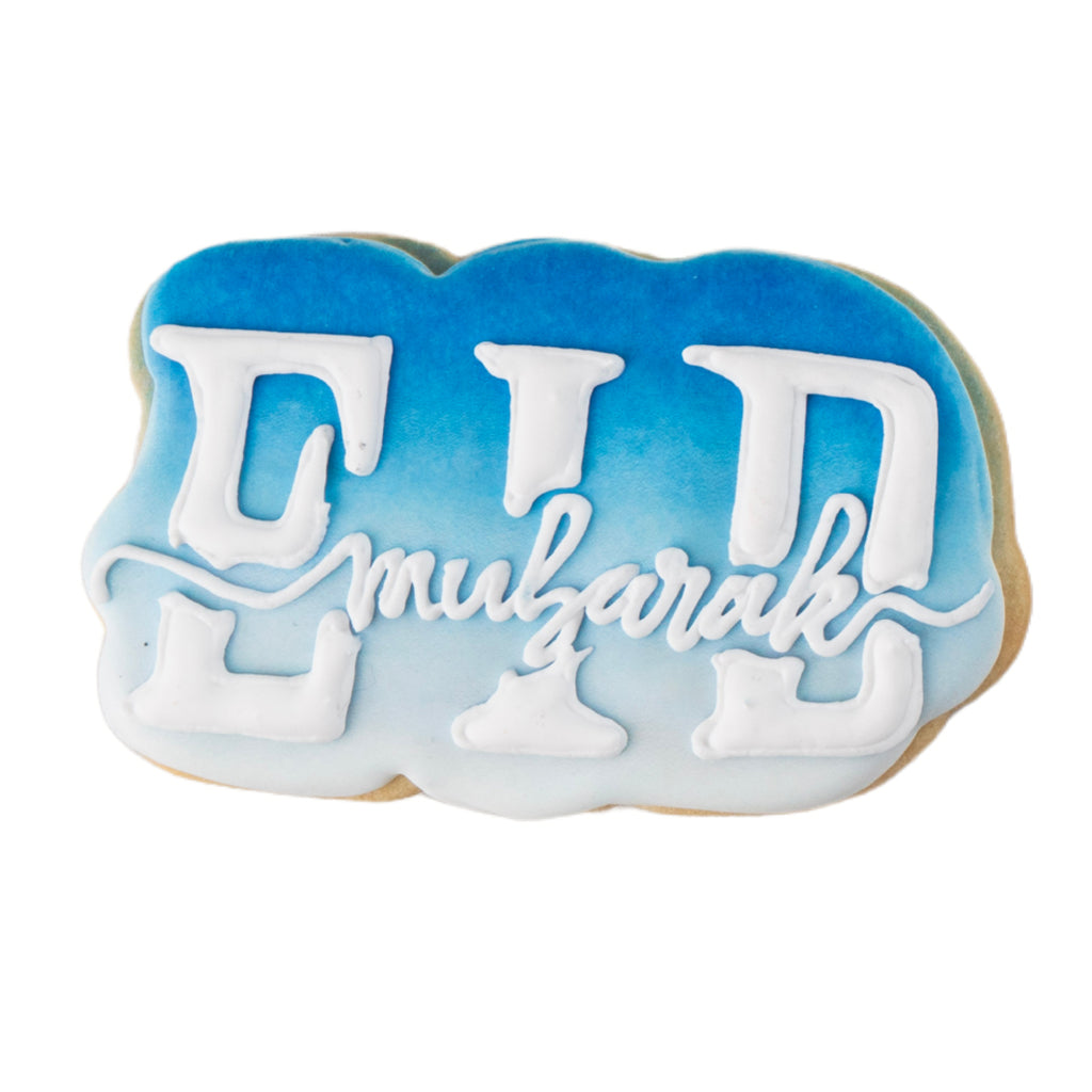 Eid Mubarak butter cookie with blue ombre icing.