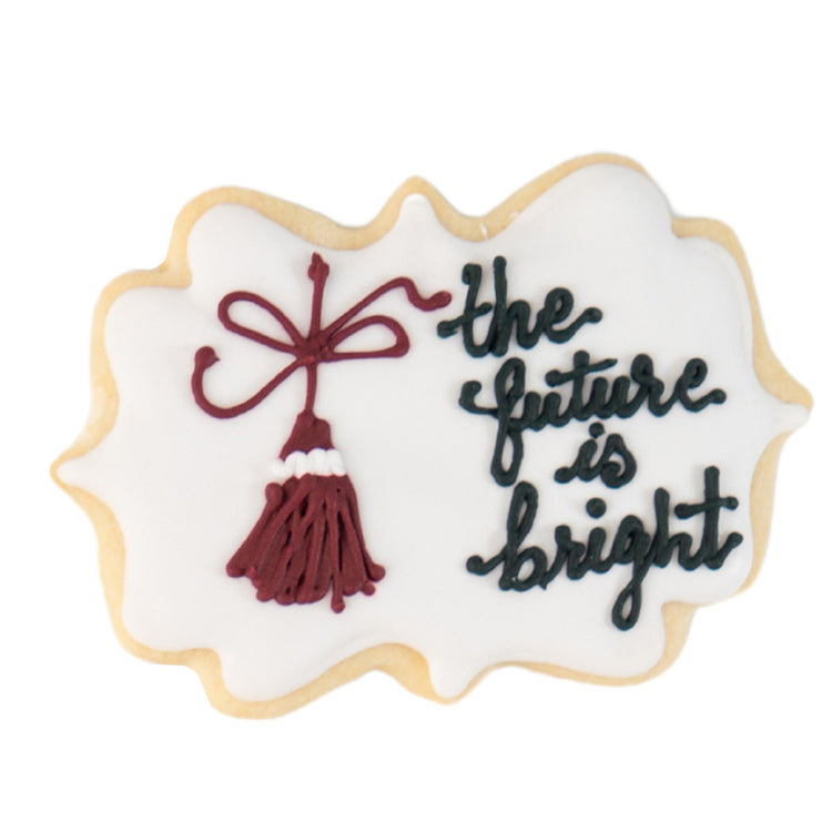Bright Future cookie with black text and a maroon tassel.