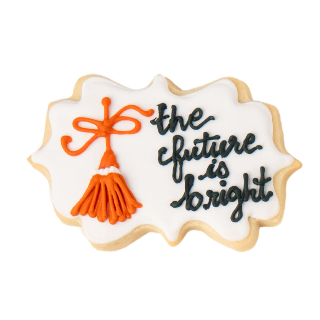 Bright Future cookie with orange tassel and black lettering.