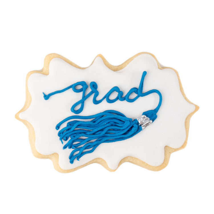 Graduation tassel cookie with blue icing on white background