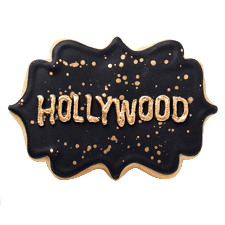 Academy Awards cookie with black icing and gold lettering.