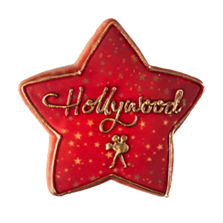 Academy Awards star-shaped cookie with red icing and gold text.