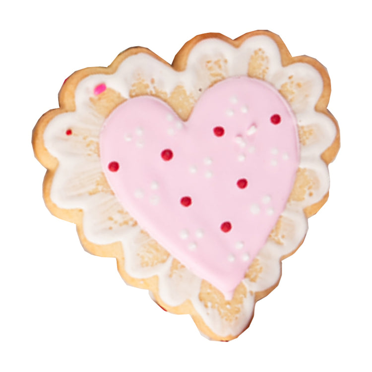 Heart-shaped Valentine butter cookie with pink and white icing.