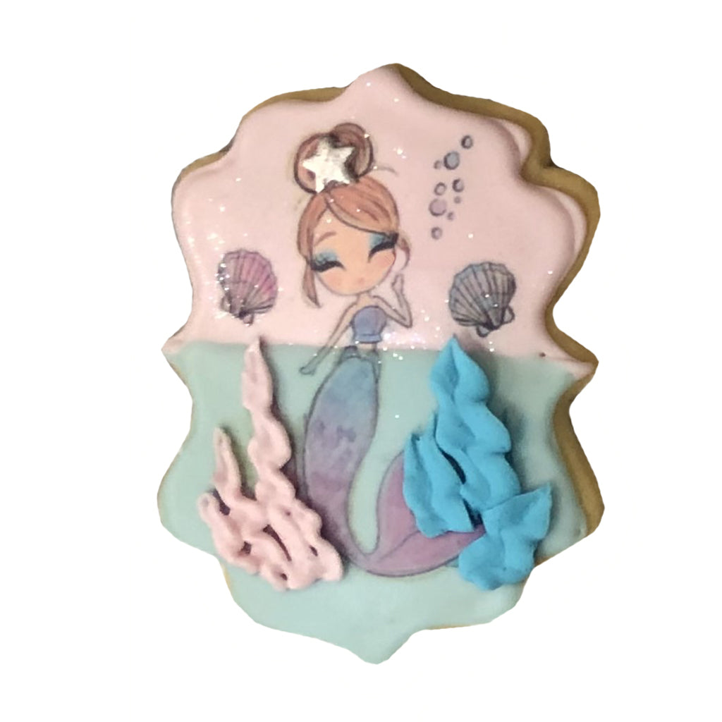 Little Mermaid cookie with pink and blue icing details.