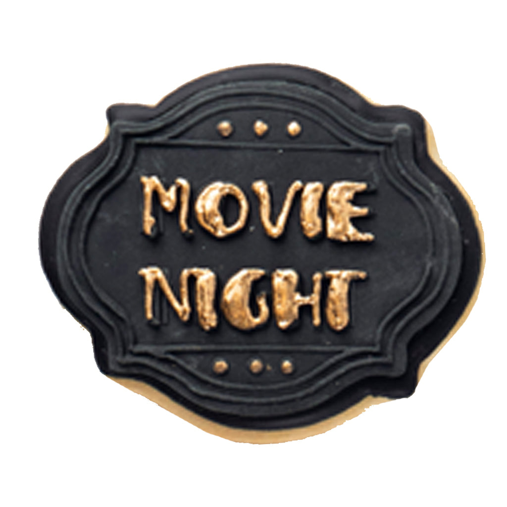 Academy Awards cookie with black icing and gold lettering.