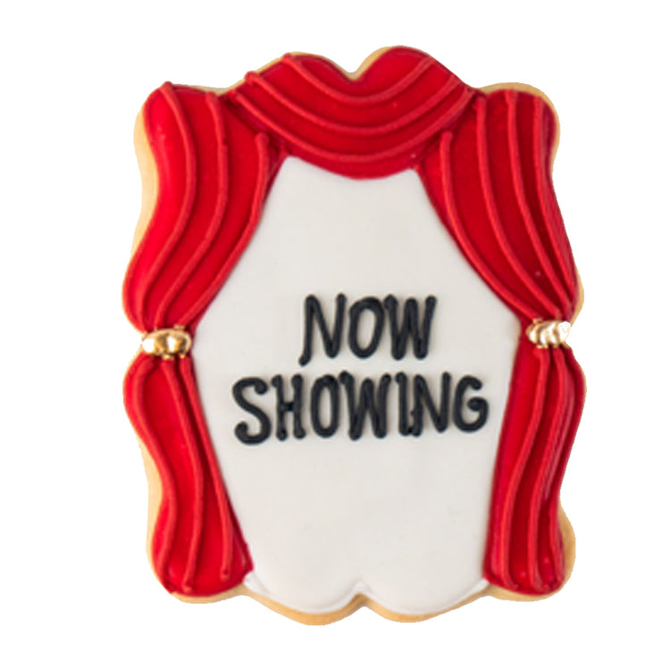 Academy Awards cookie with red stage curtains and text.