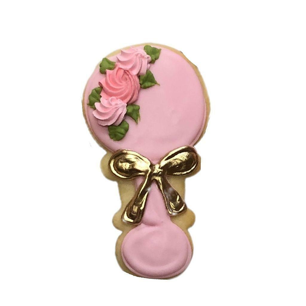 Baby Girl #1 rattle-shaped cookie with pink icing and gold bow