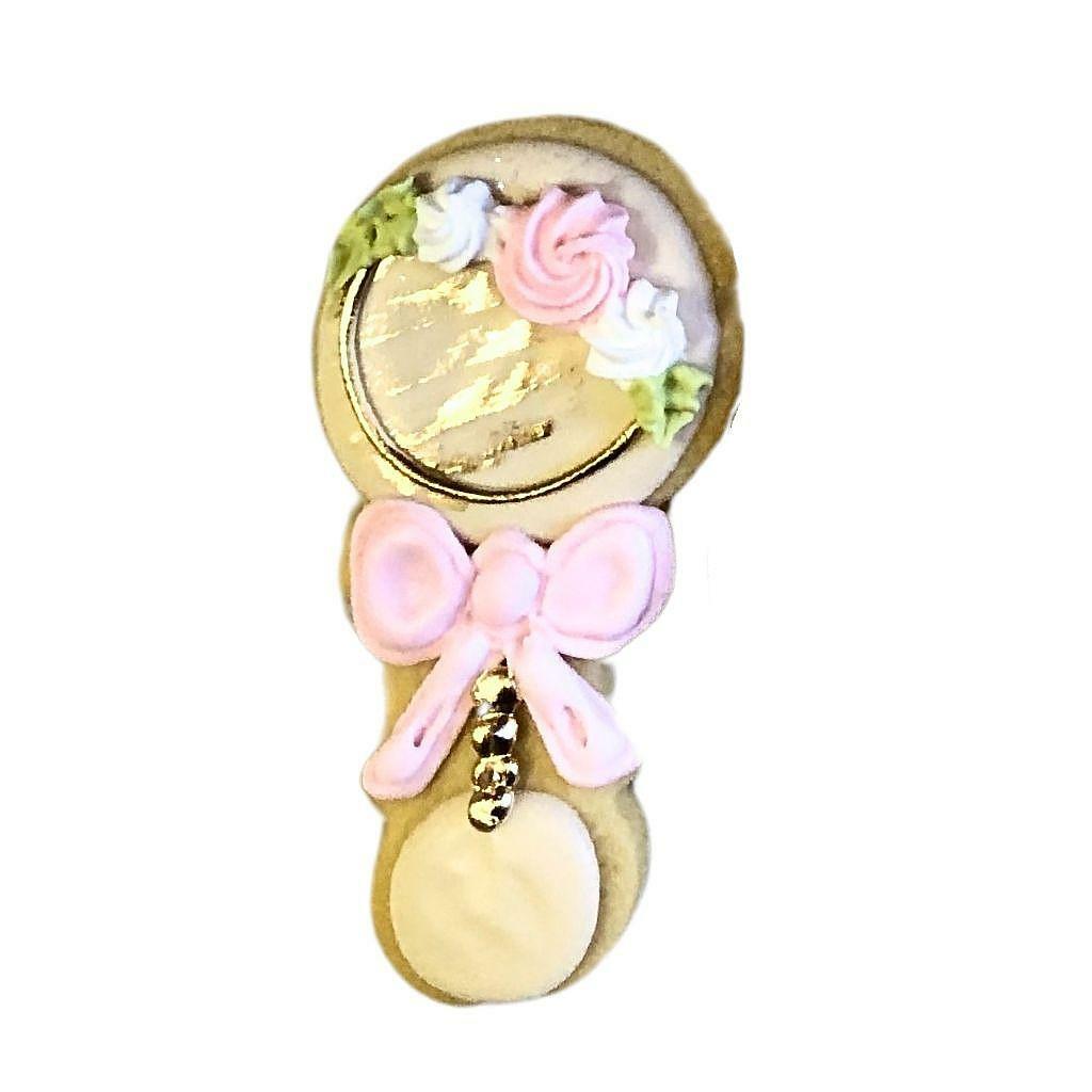 Baby Girl #2 gift box cookie shaped like a baby rattle.
