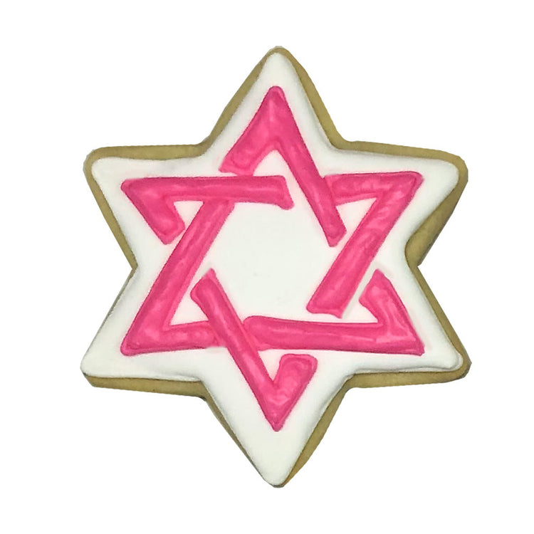Star of David cookie with white icing and pink star outline.