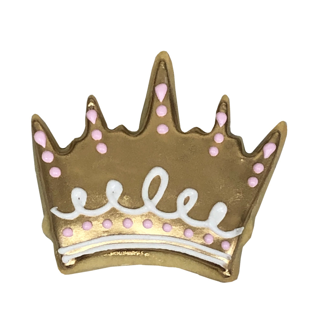 Gold princess crown cookie with pink and white icing details.