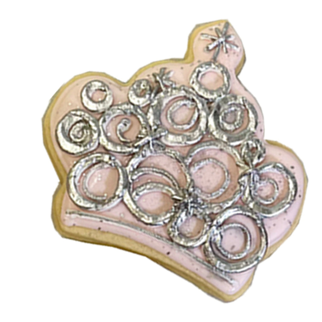 Princess crown cookie with pink icing and silver swirls.