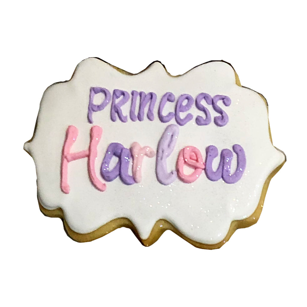 Name and Initial plaque cookie with pink and purple icing.