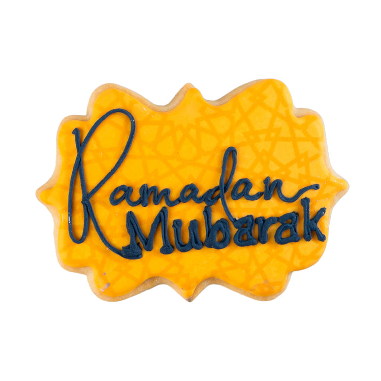 Ramadan Mubarak butter cookie with yellow icing and blue text