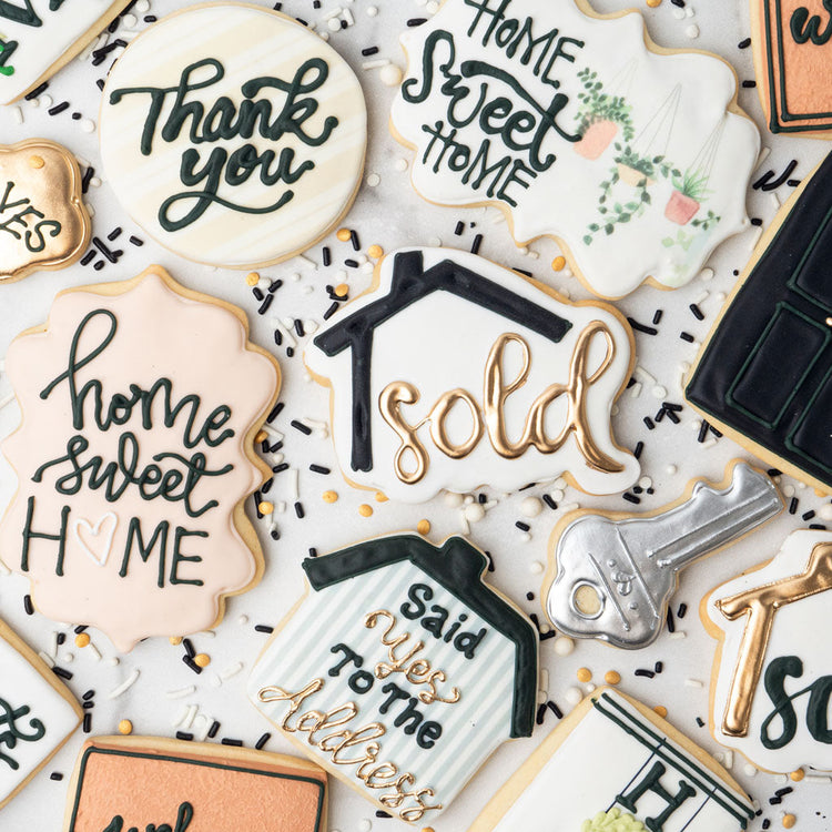 Assorted Realtor cookies with house and key designs.