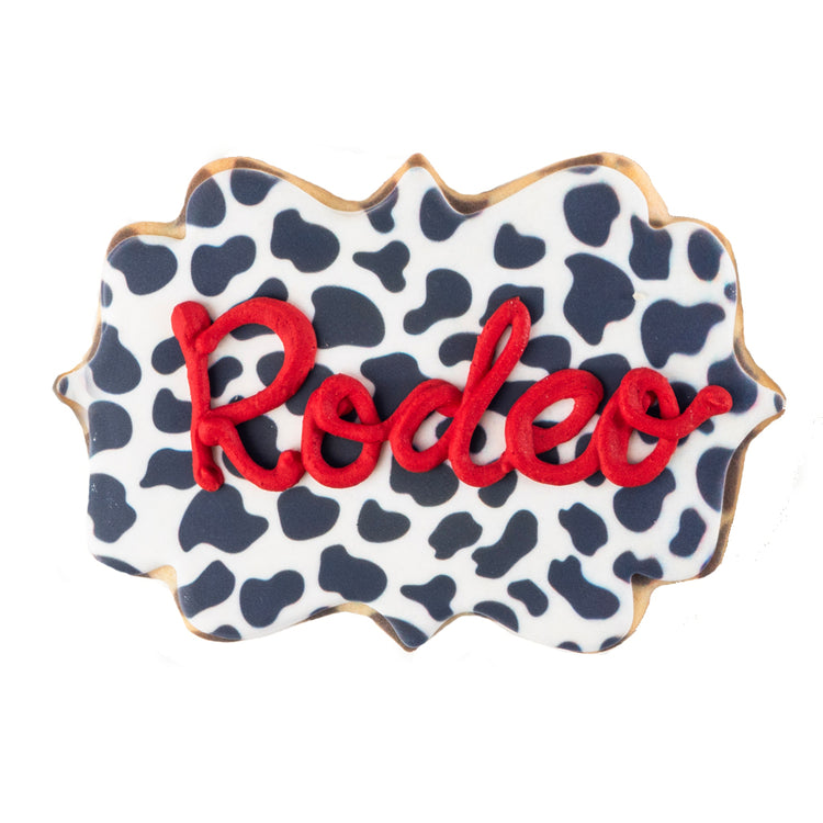 Texas icon cookie with cow print and red Rodeo icing