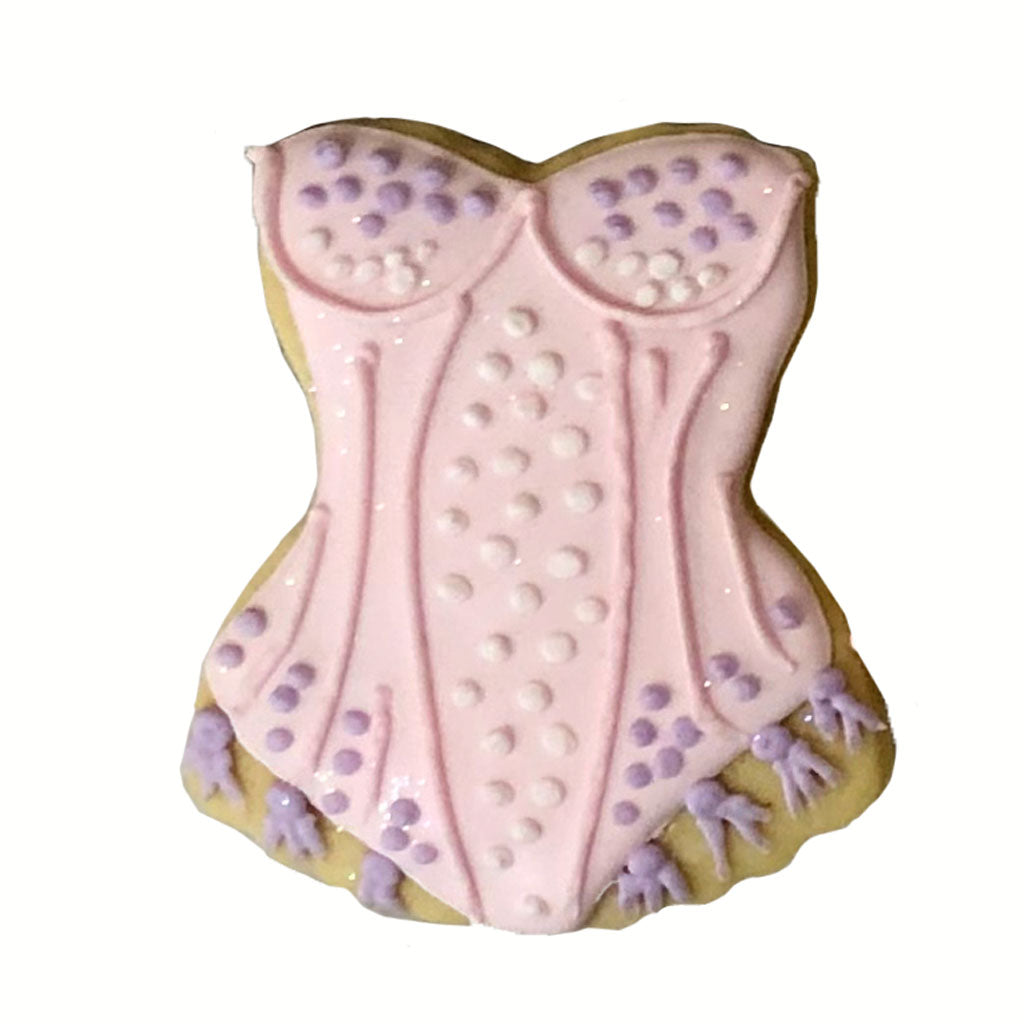 Taylor Swift bustier cookie with pink and purple icing.