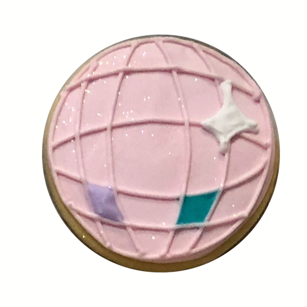 Taylor Swift disco ball cookie with pink icing and glitter.