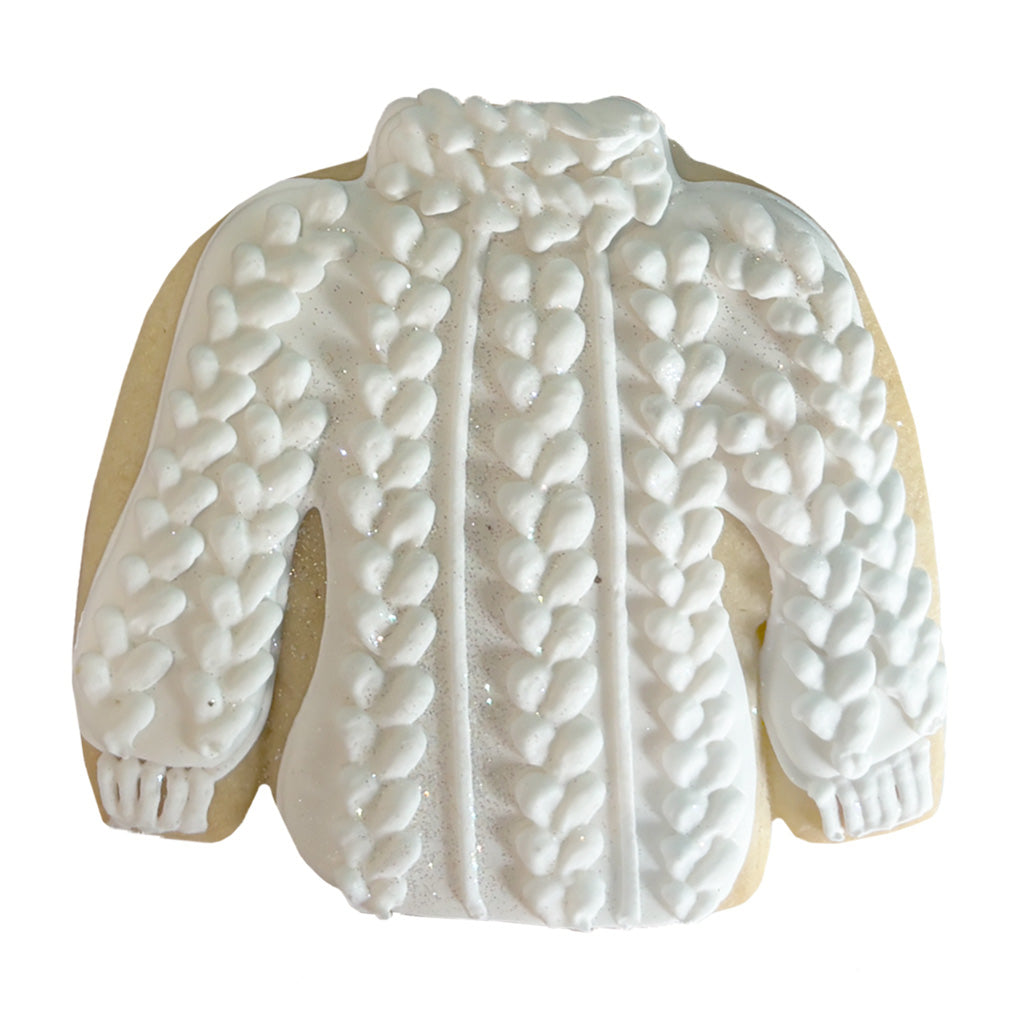 Taylor Turtleneck cookie with white cable-knit icing detail.
