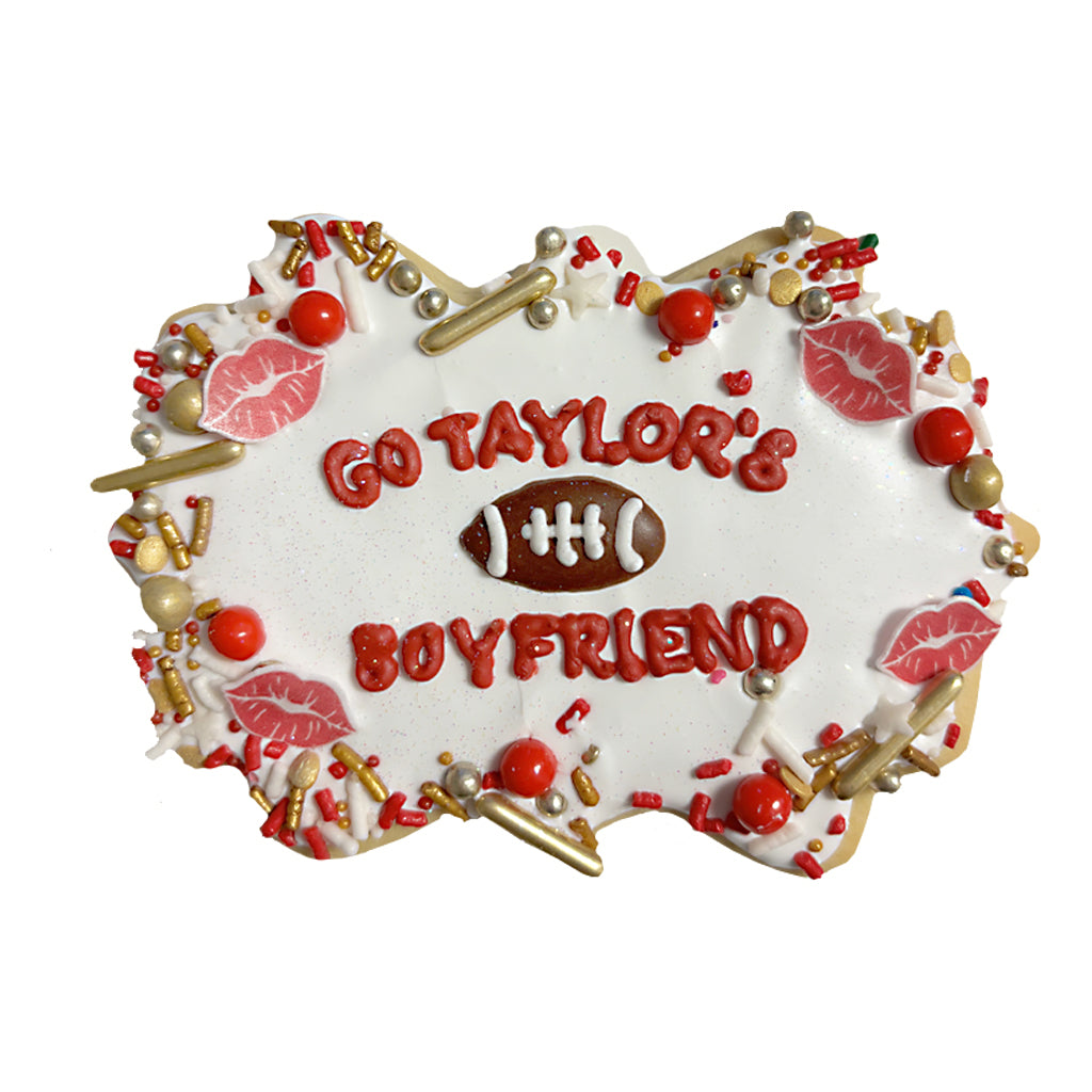 Go Taylor Swift's Boyfriend cookie with red and gold sprinkles.