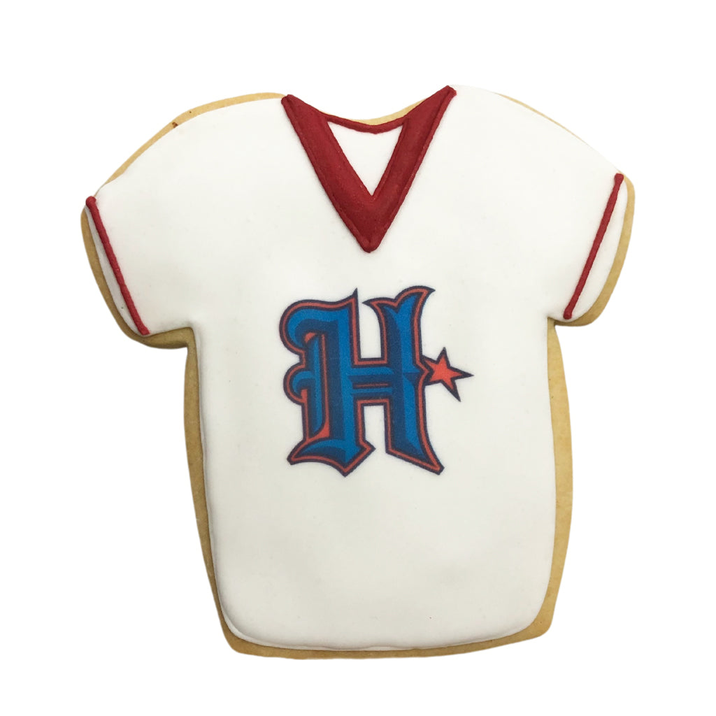 Texans jersey-shaped cookie with white icing and blue H logo.