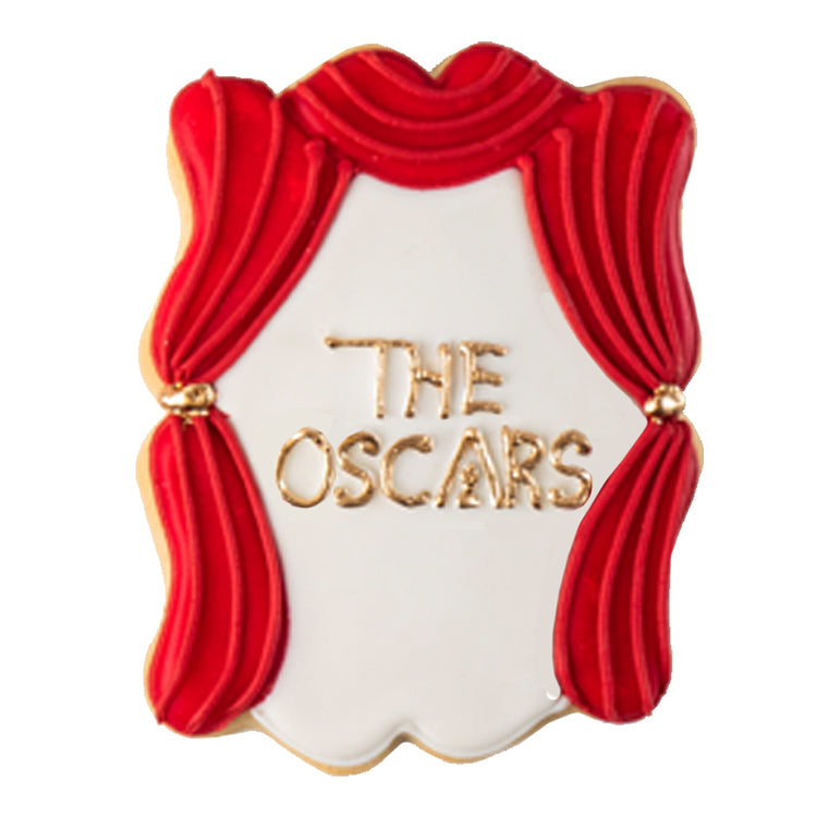 Academy Awards cookie with red curtains and gold lettering.