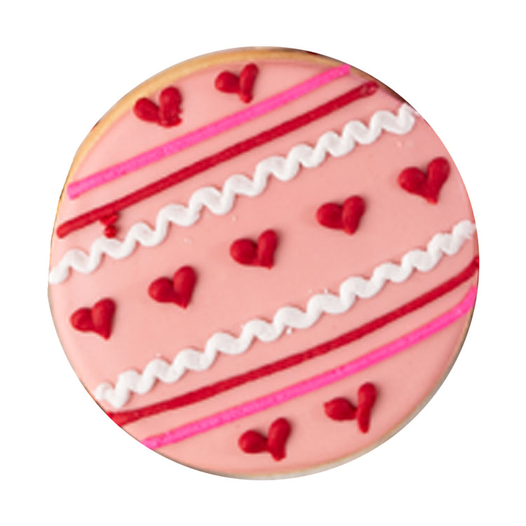 Valentine butter cookie with pink icing and red heart designs.