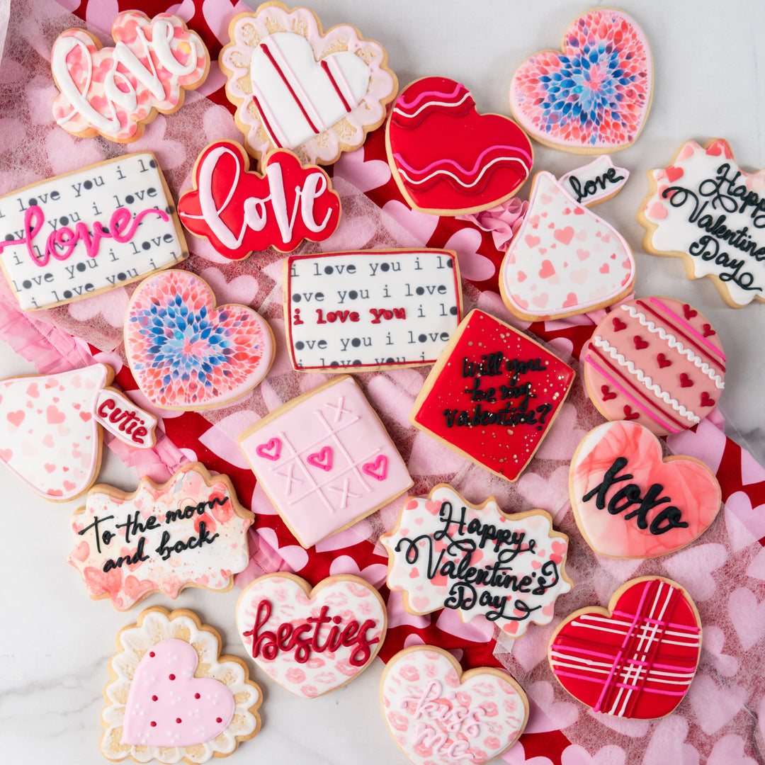 Assorted Valentine butter cookies with festive icing designs.
