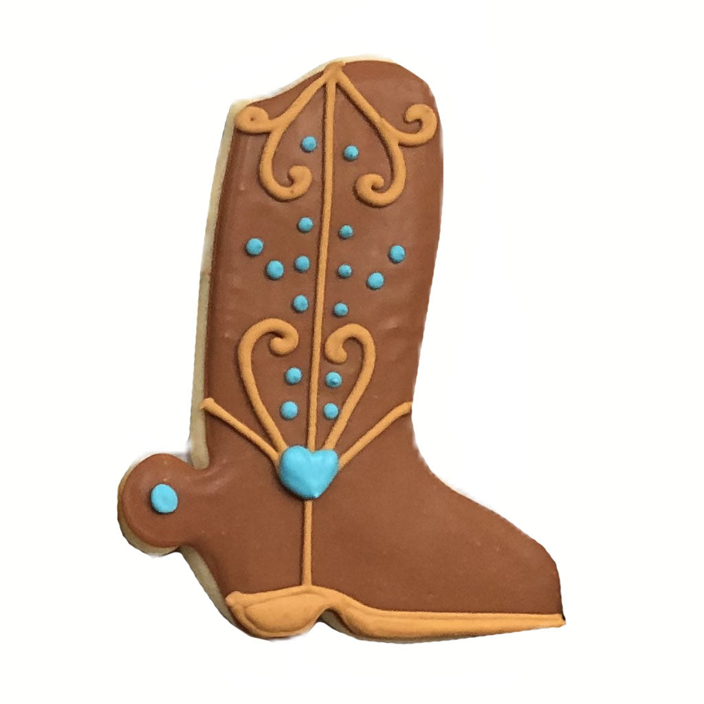 Cowboy boot cookie with brown icing and blue heart detail.