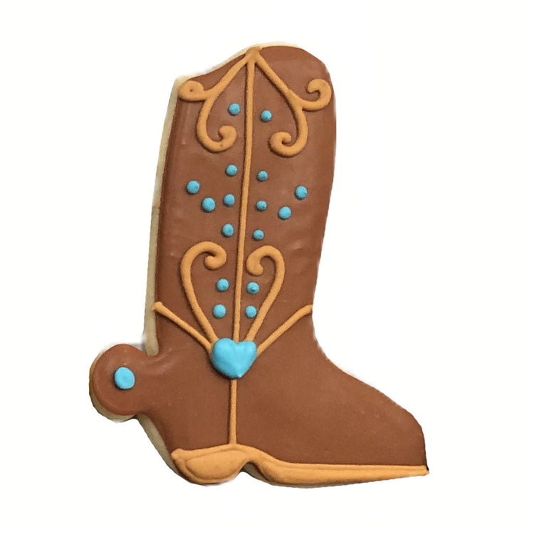 Cowboy boot cookie with brown icing and blue heart detail.