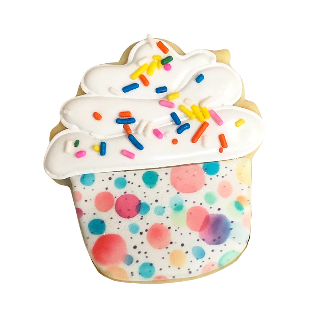 Cupcake cookie with white icing and colorful polka dots