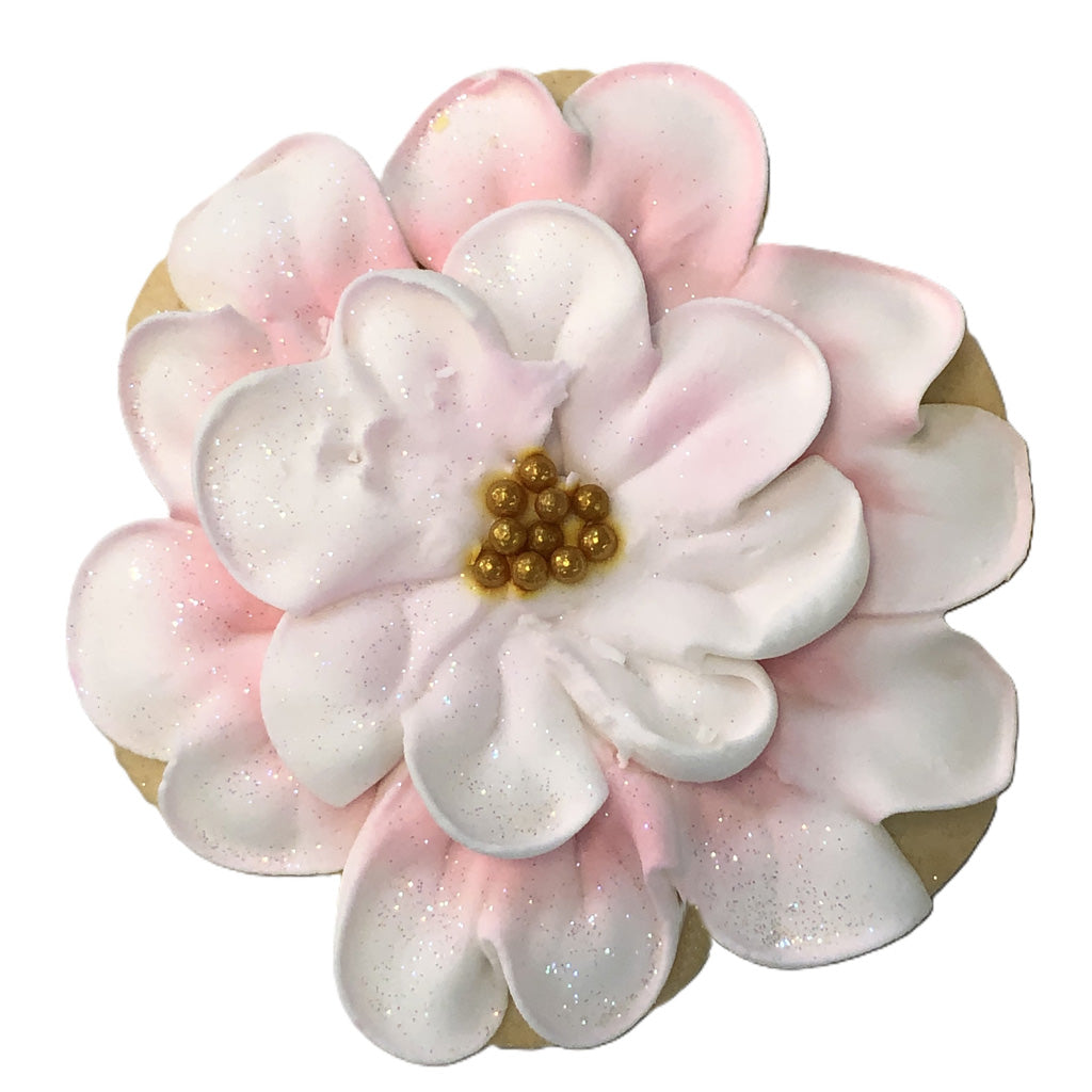 Easter butter cookie shaped like a pink and white flower.