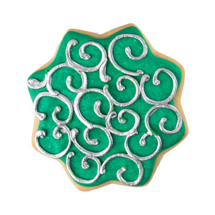 Star-shaped Ramadan butter cookie with green and silver icing.
