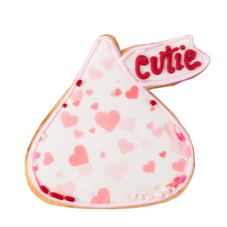 Valentine butter cookie shaped like a kiss with pink hearts